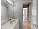 Bathroom features a neutral color scheme and a large mirror above the vanity at 1575 Wynfield Dr, Auburn, GA 30011