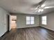 Comfortable bedroom with ceiling fan and laminate flooring, providing a cozy and inviting space at 1575 Wynfield Dr, Auburn, GA 30011