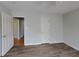 This bedroom features neutral paint, modern floors and two closets at 1575 Wynfield Dr, Auburn, GA 30011