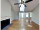 Inviting living room with a fireplace, ceiling fan, and hardwood floors for a cozy and comfortable atmosphere at 1575 Wynfield Dr, Auburn, GA 30011