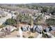 Aerial view of homes in a suburban neighborhood with mature trees and well-maintained landscaping at 1739 Praters Pt, Dacula, GA 30019