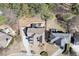 Aerial view of a well-maintained property featuring lush landscaping and a spacious driveway at 1739 Praters Pt, Dacula, GA 30019