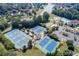 Aerial view featuring community's tennis courts, playground, pool, clubhouse, and scenic lake at 1739 Praters Pt, Dacula, GA 30019