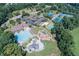 Aerial view showcases community amenities including a pool, playground, tennis courts, and clubhouse at 1739 Praters Pt, Dacula, GA 30019