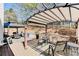 Inviting back deck with outdoor seating, a pergola, and a view of the fenced yard at 1739 Praters Pt, Dacula, GA 30019