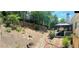 Backyard features a stone path, gazebo and sloped garden with a wooden fence in background at 1739 Praters Pt, Dacula, GA 30019