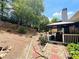 Backyard featuring a stone pathway, deck, and a gazebo at 1739 Praters Pt, Dacula, GA 30019