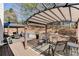 Expansive backyard features a covered patio with outdoor seating, pergola, and privacy fence at 1739 Praters Pt, Dacula, GA 30019