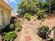 Stone and brick pathway in backyard with natural landscaping and wooded backdrop at 1739 Praters Pt, Dacula, GA 30019