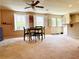 Finished basement area featuring multiple windows for natural light and a walkout door to the backyard at 1739 Praters Pt, Dacula, GA 30019