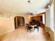 Basement living area features a ceiling fan, neutral paint, and walkout window to the backyard at 1739 Praters Pt, Dacula, GA 30019