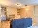 Finished basement space with built-in shelves and neutral carpeting at 1739 Praters Pt, Dacula, GA 30019