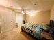 Bedroom with a ceiling fan, closet, and a bed with floral bedding at 1739 Praters Pt, Dacula, GA 30019