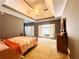 Spacious bedroom features tray ceilings, neutral carpet and a large window at 1739 Praters Pt, Dacula, GA 30019