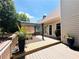 Outdoor deck area with potted plants and wood floors at 1739 Praters Pt, Dacula, GA 30019