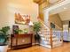 Inviting foyer with hardwood floors, staircase, and elegant decor at 1739 Praters Pt, Dacula, GA 30019