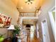 Inviting foyer with hardwood floors, staircase, and elegant decor at 1739 Praters Pt, Dacula, GA 30019