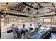 Comfortable gazebo with cozy seating, ceiling fans and string lights for relaxing outdoors at 1739 Praters Pt, Dacula, GA 30019