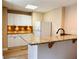 Kitchen featuring granite countertops, white cabinets, and stainless steel appliances at 1739 Praters Pt, Dacula, GA 30019