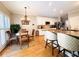 Eat-in kitchen features granite counters, stainless appliances, and hardwood floors at 1739 Praters Pt, Dacula, GA 30019