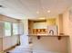 Basement eat in kitchen featuring granite countertops, white cabinets and a double door to the backyard at 1739 Praters Pt, Dacula, GA 30019