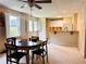 Open floor plan with eat in kitchen area, white cabinets, and a breakfast bar for extra seating at 1739 Praters Pt, Dacula, GA 30019