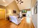 Bright living room with vaulted ceilings, hardwood floors, and a cozy fireplace creating a welcoming space at 1739 Praters Pt, Dacula, GA 30019