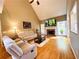 Bright living room features hardwood floors, vaulted ceilings, and a cozy fireplace at 1739 Praters Pt, Dacula, GA 30019