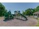 Community playground featuring multiple slides, climbing structures, and a soft, safe ground covering at 1739 Praters Pt, Dacula, GA 30019