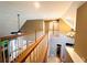 Open staircase with wood railing that overlooks the living room at 1739 Praters Pt, Dacula, GA 30019