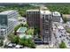 Aerial view showcases this high-rise next to the city, pool and parking at 1820 Peachtree St # 311, Atlanta, GA 30309