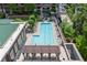 Stunning aerial view of the rooftop pool, sundeck, and surrounding cityscape at 1820 Peachtree St # 311, Atlanta, GA 30309
