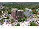Upscale condo with surrounding buildings, trees, and parking at 1820 Peachtree St # 311, Atlanta, GA 30309