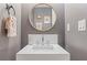 Stylish powder room featuring modern fixtures, elegant mirror, and sleek design elements at 1820 Peachtree St # 311, Atlanta, GA 30309