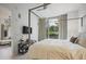Comfortable bedroom featuring a canopy bed, stylish decor, and a large window offering natural light at 1820 Peachtree St # 311, Atlanta, GA 30309
