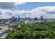 Scenic skyline view of downtown from surrounding trees and buildings at 1820 Peachtree St # 311, Atlanta, GA 30309