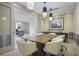 Meeting space with a communal wooden table, and a window to the outside at 1820 Peachtree St # 311, Atlanta, GA 30309