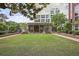 Well-manicured outdoor lawn area with building in the background at 1820 Peachtree St # 311, Atlanta, GA 30309