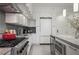 Well-equipped kitchen with stainless appliances, stylish backsplash, granite countertops, and ample counter space at 1820 Peachtree St # 311, Atlanta, GA 30309
