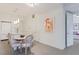 Contemporary kitchen with white cabinets, stainless appliances, granite countertops and a dining area at 1820 Peachtree St # 311, Atlanta, GA 30309