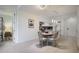 Bright kitchen with granite countertops, white cabinets, eat-in dining area, and hardwood flooring at 1820 Peachtree St # 311, Atlanta, GA 30309