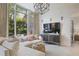 Bright living room with large windows, modern lighting, and comfortable sectional sofa at 1820 Peachtree St # 311, Atlanta, GA 30309