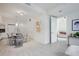 Open-concept living space with a modern kitchen, dining area, and cozy seating at 1820 Peachtree St # 311, Atlanta, GA 30309