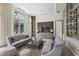 Comfortable living space with stylish sofas, a modern coffee table, and a view of outdoor greenery at 1820 Peachtree St # 311, Atlanta, GA 30309