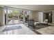 Lobby area with glass doors leading to the outside with a rug and chairs at 1820 Peachtree St # 311, Atlanta, GA 30309