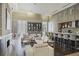 Resident lounge area with fireplace, sofas, chairs, and kitchen at 1820 Peachtree St # 311, Atlanta, GA 30309