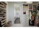 Organized walk-in closet with custom shelving, drawers, and ample storage space, leading to a bathroom at 1820 Peachtree St # 311, Atlanta, GA 30309