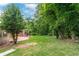 Expansive backyard featuring lush greenery and mature trees, creating a private oasis at 2655 Hayden Dr, East Point, GA 30344