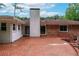 Brick patio backyard with classic brick home and a tall chimney at 2655 Hayden Dr, East Point, GA 30344