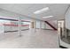 Large basement featuring tile flooring, a wet bar, and stairway at 2655 Hayden Dr, East Point, GA 30344